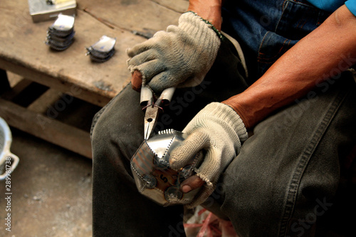 man working in factory - alms bowl