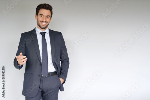 Businessman standing on white background photo