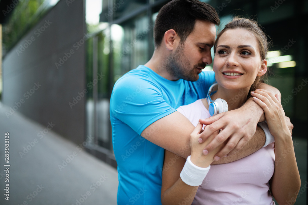 Fototapeta premium Sporty happy couple exercising together. Sport concept