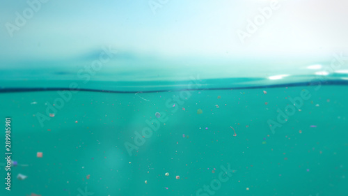 microplastics floating in water, underwater micro plastic pollution