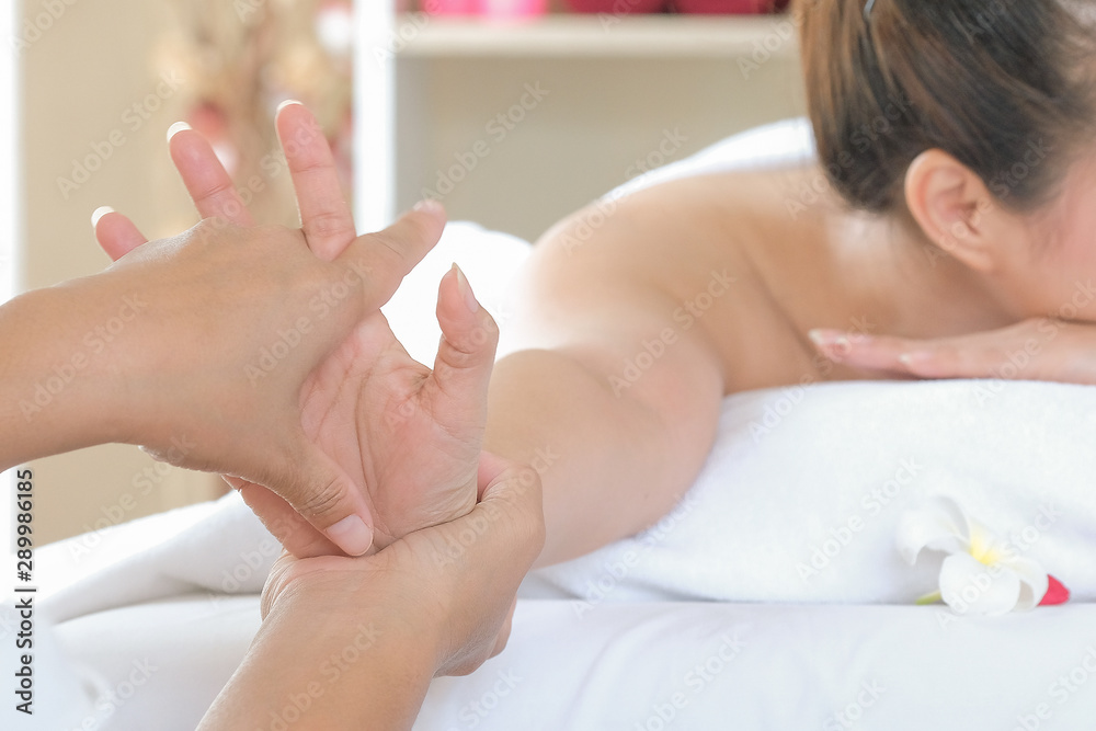 Fototapeta premium Hand spa massage over clean white bed background - people relax with hand massage service
