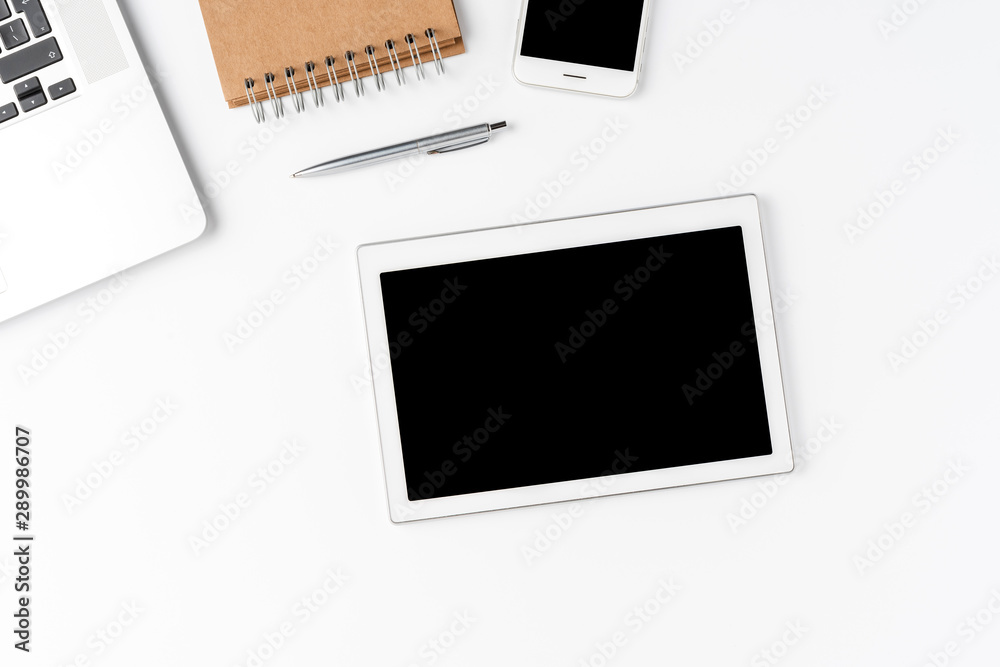 Minimalist workspace with business accessories and digital tablet with empty screen. Office desktop Minimalist workspace with business accessories and digital tablet with empty screen. Office desktop