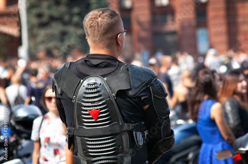 man in biker clothes on a biker party, parade of motorcyles photo