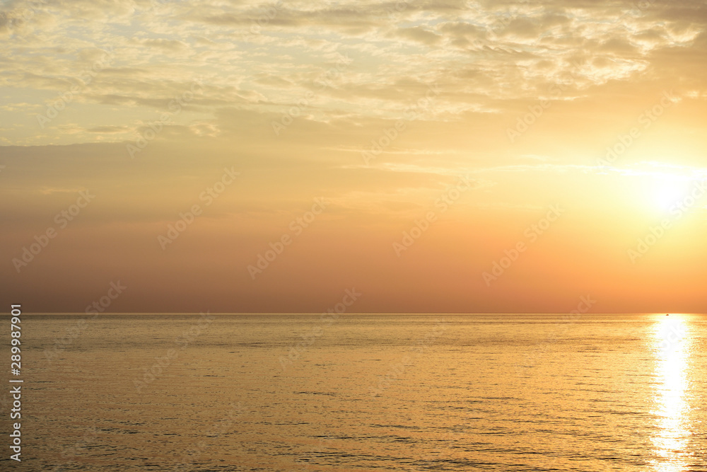 Beautiful sunrise over the sea on the coast of Sicily. Cefalu, Italy