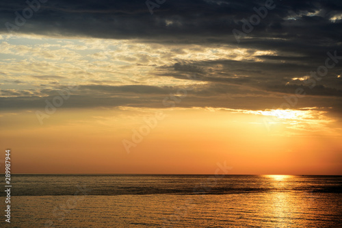 Beautiful sunrise over the sea on the coast of Sicily. Cefalu, Italy © Talulla