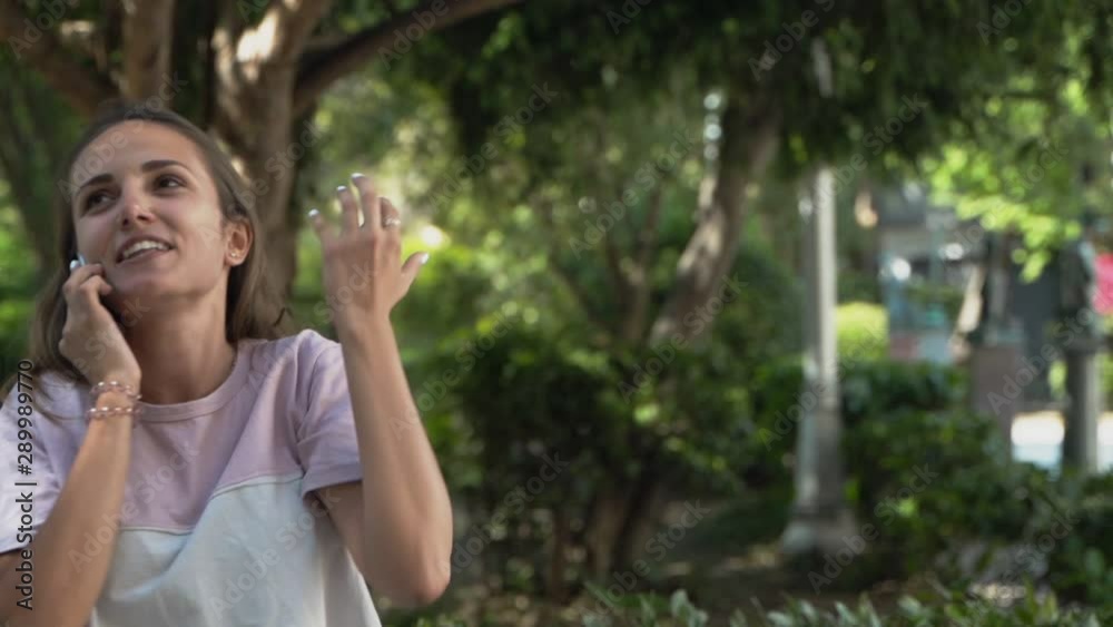 Beautiful girl joyfully talking on a cell phone Beautiful girl joyfully talking on a cell phone