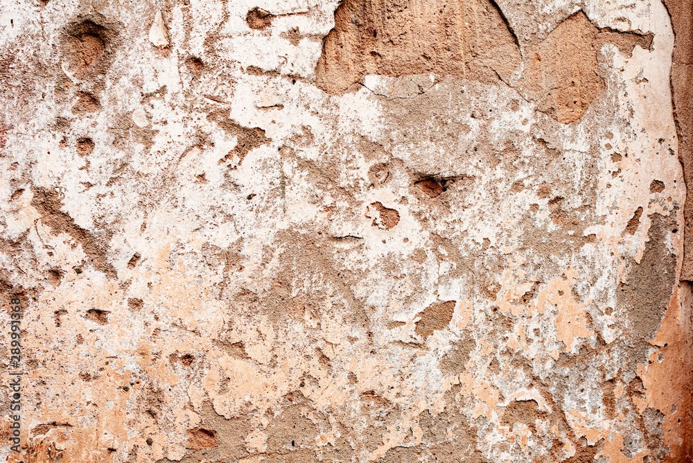 Texture of a concrete wall with cracks and scratches which can be used as a background Texture of a concrete wall with cracks and scratches which can be used as a background