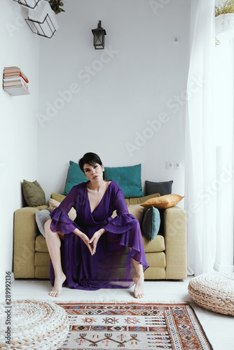 female with short haircut poses in Tbilisi loft