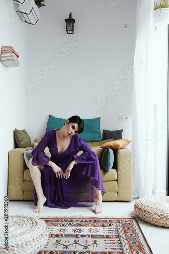 female with short haircut poses in Tbilisi loft