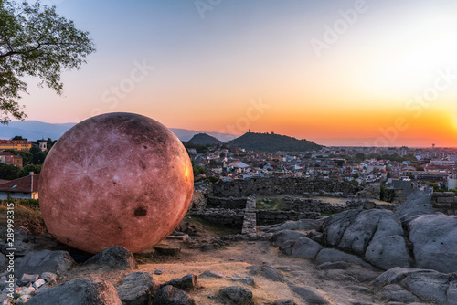 Plovdiv city, Bulgaria - September 15 2019: Full moon is landing on Nebet tepe Hill in Plovdiv city, Bulgaria