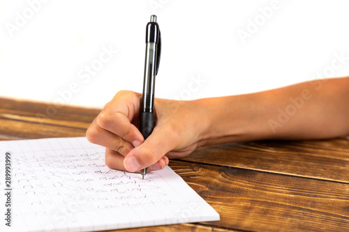 drawing child on wooden desk