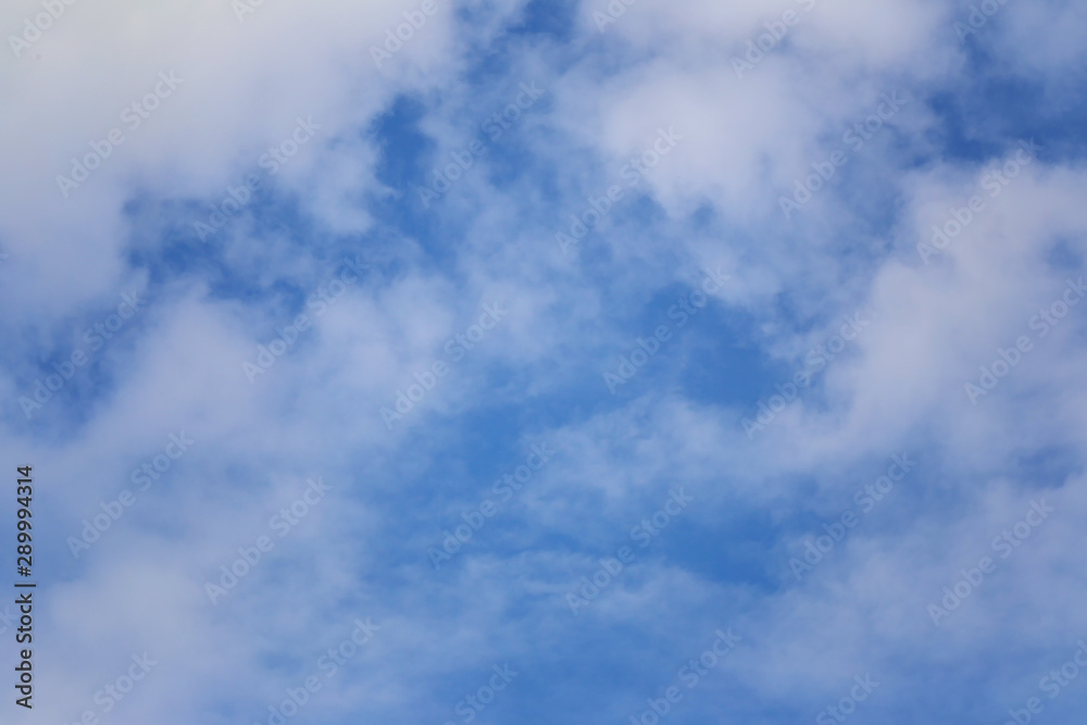 Blue sky with white clouds in the daytime background. Blue sky with white clouds in the daytime background.