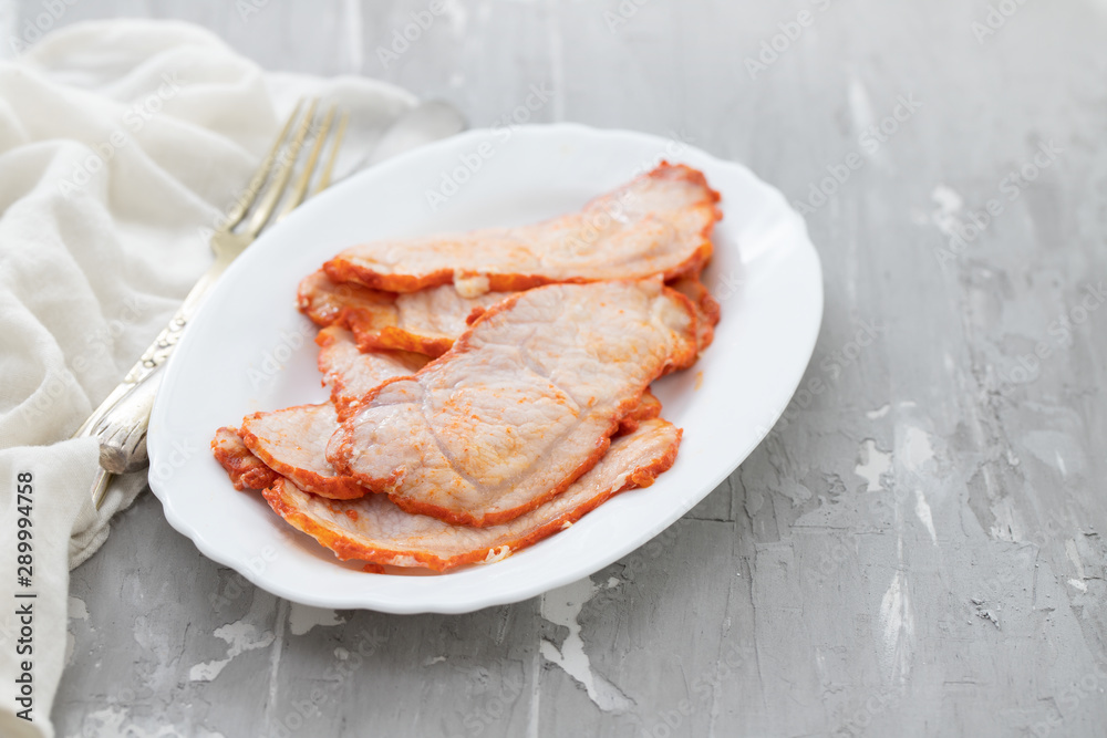 fried meat on white dish on ceramic background fried meat on white dish on ceramic background