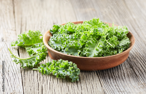 Kale cabbage on wooden background