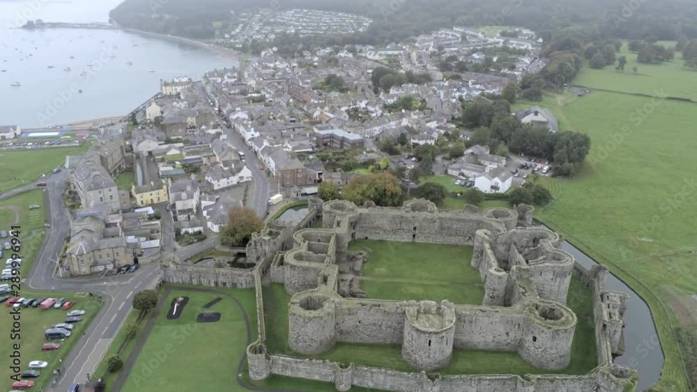 Beaumaris castle, Anglesey, Wales. Aerial view above coastal town ...