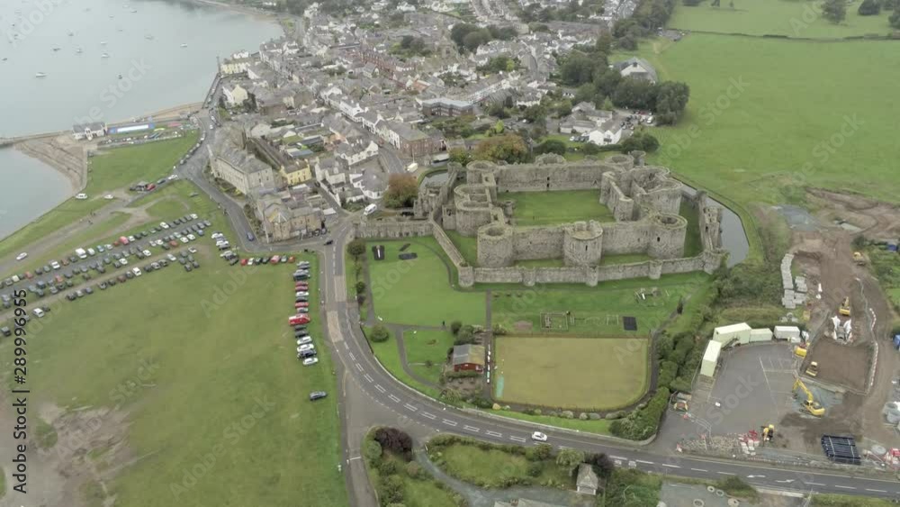 Beaumaris castle, Anglesey, Wales. Aerial view above coastal town