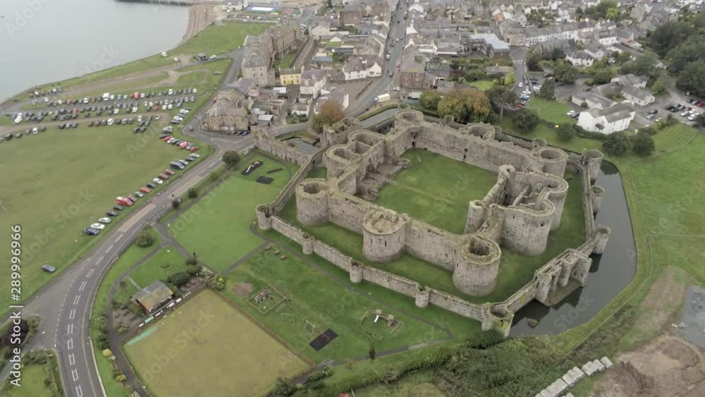 Beaumaris castle, Anglesey, Wales. Aerial view above coastal town ...