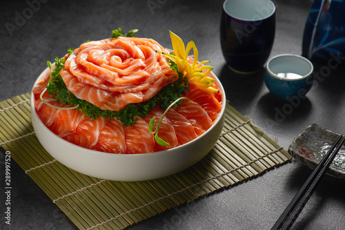 Sashimi salmon with fruits and vegetables. Asian menu. Sashimi salmon with fruits and vegetables on black background