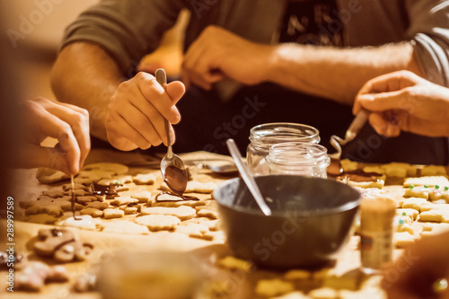 Group of young people baking cookies for christmas