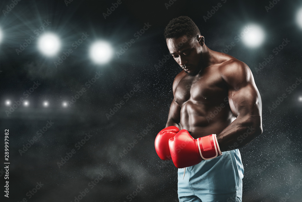 African american boxer staying on stadium boxing arena