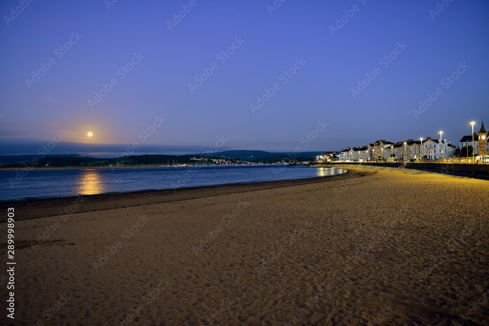 The River Exe Estuary, Exmouth UK at dawn under a full moon