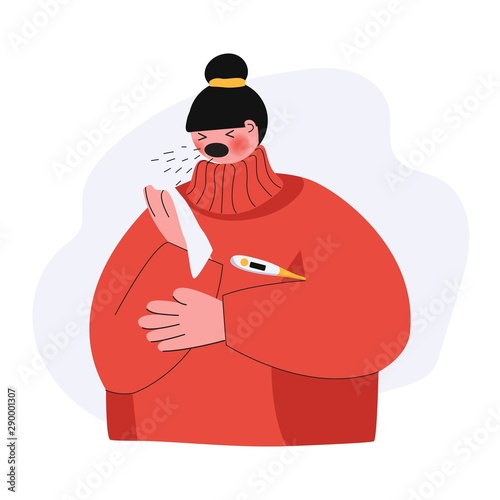 A young woman with a headache, fever and runny nose sneezes in his handkerchief and measures temperature