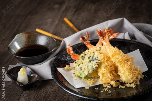 The tempura shrimps with sauce, deep-fried shrimps in the traditional Japanese restaurant.
