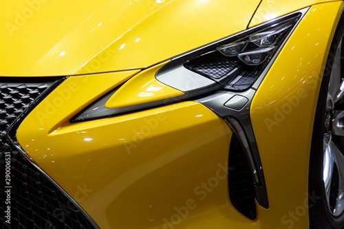 close up front view headlight yellow color car © Rattanachai