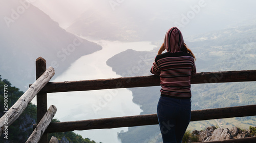 Woman in jeans on the amazing lake Perucac mountain Tara
