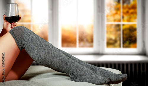 Slim young woman legs and autumn socks 
