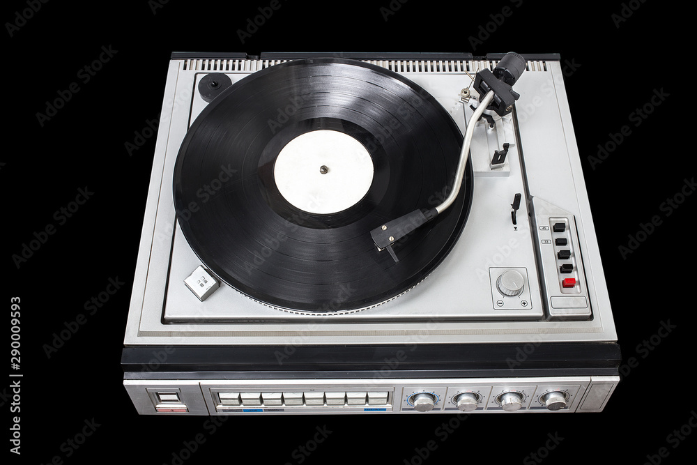 Obraz premium Vintage record player with radio tuner on black background