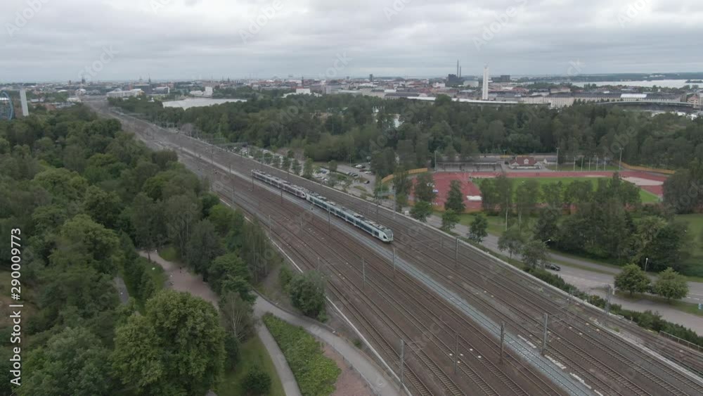 Flying over the train and railways in city of Helsinki. Aerial drone shot. Finland transport. Railroad. Flying over the train and railways in city of Helsinki. Aerial drone shot. Finland transport. Railroad.