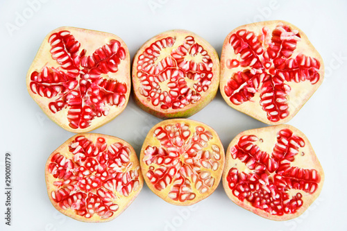round sliced slices of red natural pomegranate with grains