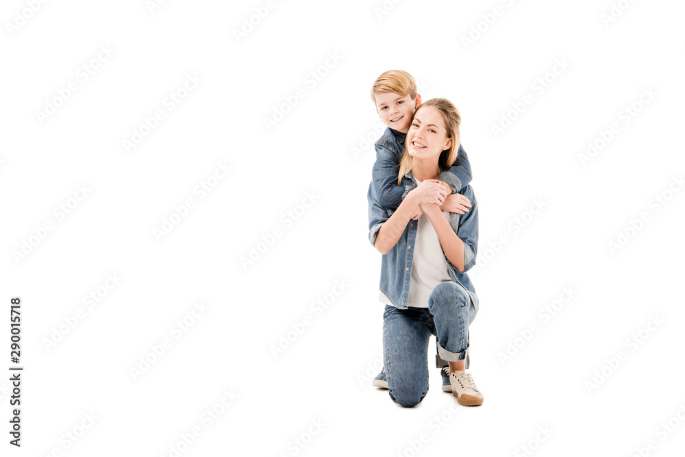 happy mother and son embracing isolated on white happy mother and son embracing isolated on white