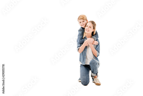 happy mother and son embracing isolated on white