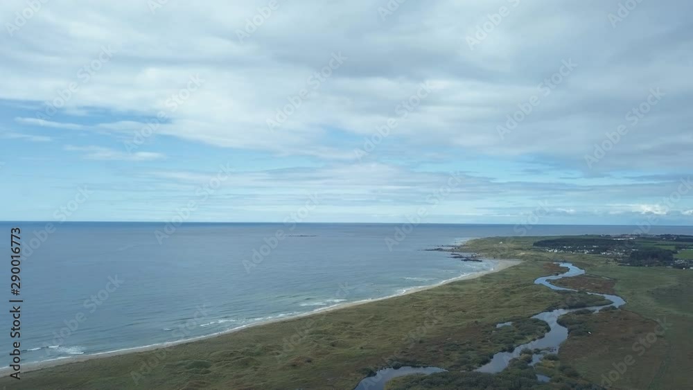Aerial shot over coast line in Norway. River, sandy beach and the Atlantic Ocean in the background. Aerial shot over coast line in Norway. River, sandy beach and the Atlantic Ocean in the background.