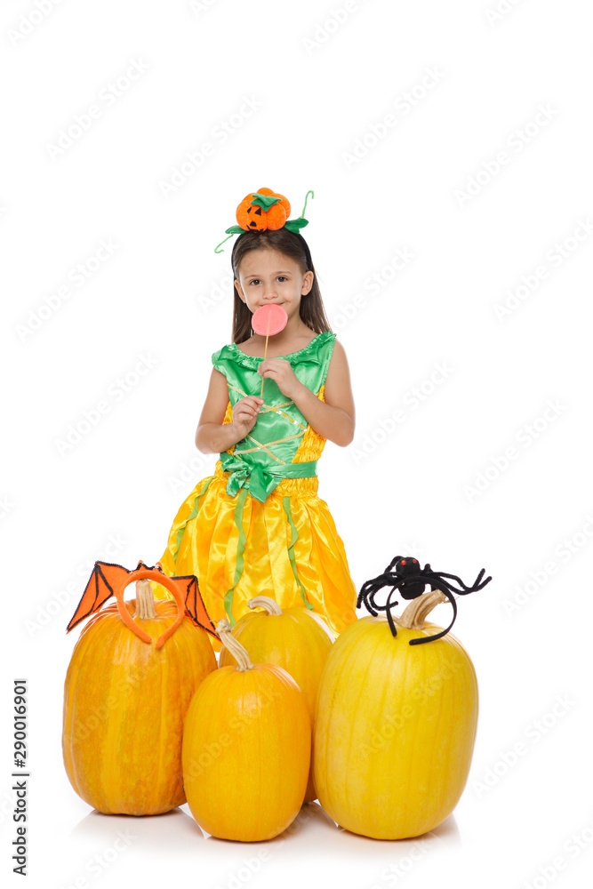 Cute little girl in pumpkin costume on white background. Happy Halloween! Cute little girl in pumpkin costume on white background. Happy Halloween!