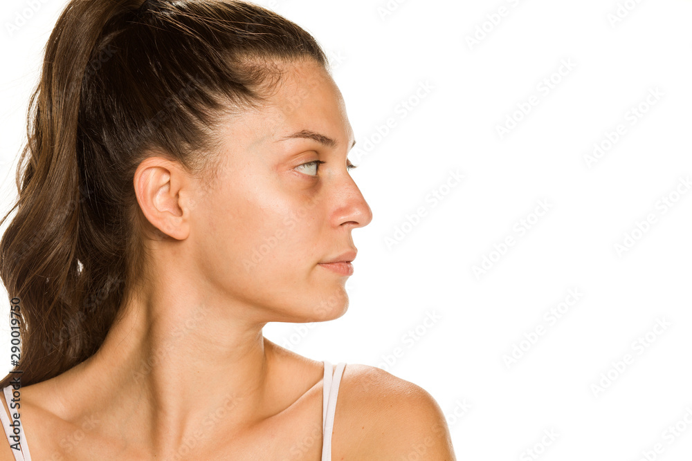 Profile of bautiful young woman without makeup on white background Profile of bautiful young woman without makeup on white background