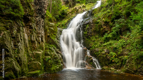 Waterfall in mountains. Famous Kamienczyk waterfall in the Karkonosze National Park in Sudety mountains  Poland