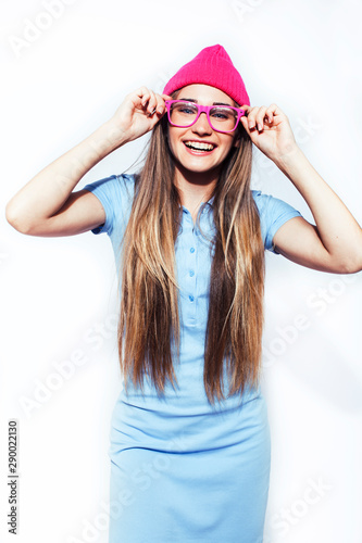young pretty teenage modern hipster girl posing emotional happy isolated on white background, wearing pink hat and glasses, lifestyle people concept © iordani