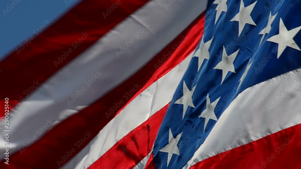 The flag of the United States flashes in the wind. The flag of the United States flashes in the wind.