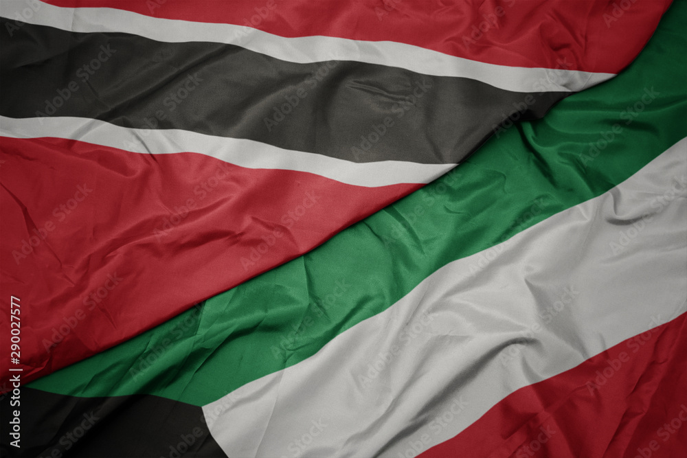 waving colorful flag of kuwait and national flag of trinidad and tobago.