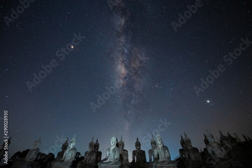 Buddha statue and milky way