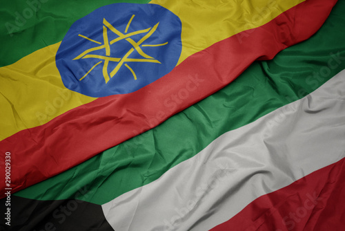 waving colorful flag of kuwait and national flag of ethiopia .