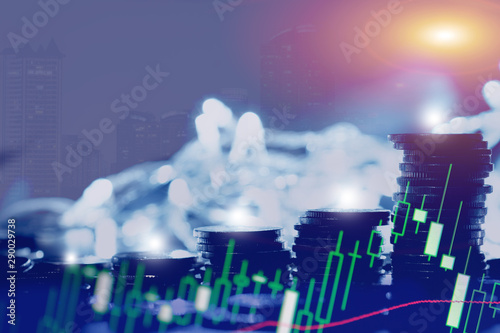 Financial investment concept, Double exposure of city night and stack of coins for finance investor, Forex trading candlestick chart economic , ECN Digital economy, business.