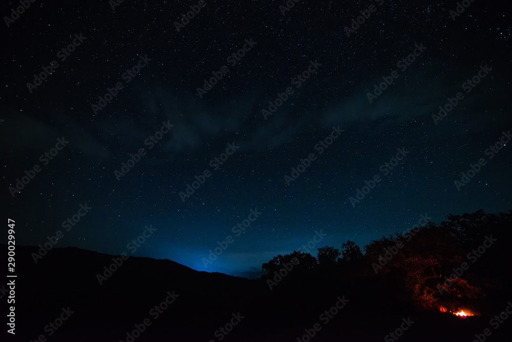 Starry sky at night in the mountains.