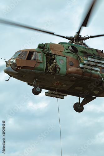 Landing of special forces on a rope from a Mi-8 helicopter