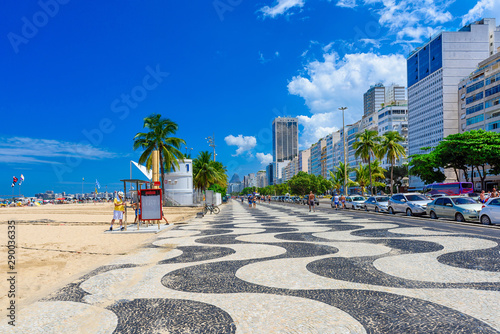 Fototapeta Naklejka Na Ścianę i Meble -  View of Leme beach and Copacabana with palms and mosaic of sidewalk in Rio de Janeiro, Brazil. Copacabana beach is the most famous beach in Rio de Janeiro. Sunny cityscape of Rio de Janeiro
