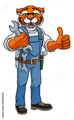 Fototapeta Naklejka Na Ścianę i Meble -  A tiger cartoon animal mascot plumber, mechanic or handyman builder construction maintenance contractor holding a spanner or wrench and giving a thumbs up