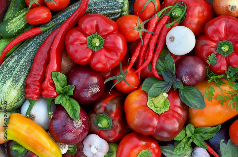 Various fresh vegetables as a background, top view. Healthy eating concept.